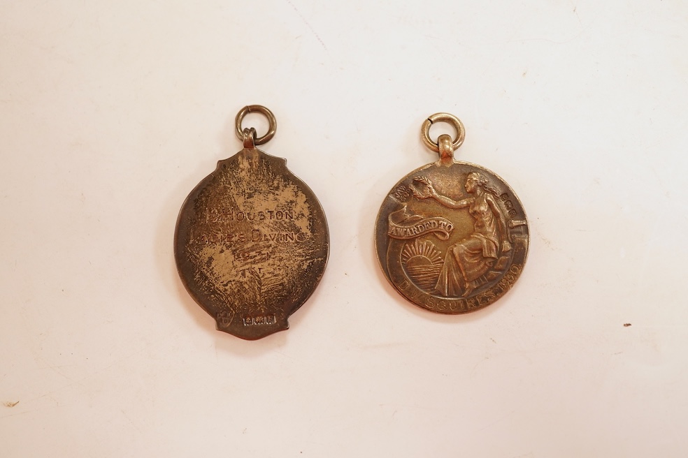 A quantity of assorted silver life-saving and swimming medals, early 20th century, cased